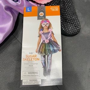 Kids sugar skeleton costume. NWT. Lg(10-12) dress, leggings, and mask